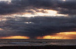 Hawaiian rain shower at sunset